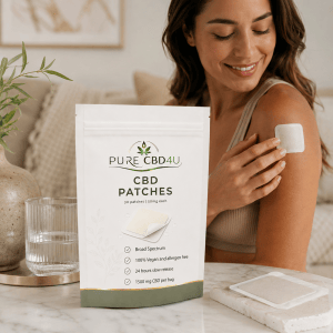 Person applying Pure CBD4U CBD Patches 50mg CBD + CBG in an elegant wellness setting.